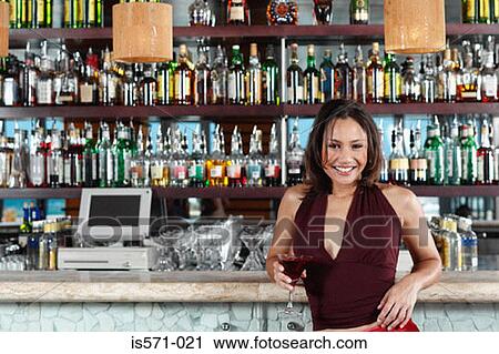 Smiling woman leaning on bar View Large Photo Image Stock Image - Smiling woman leaning on bar. Fotosearch