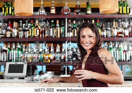 Smiling woman leaning on bar View Large Photo Image Stock Image - Smiling woman leaning on bar. Fotosearch