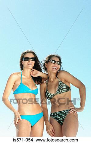 Women wearing bikinis View Large Photo Image Picture - Women wearing bikinis. Fotosearch
