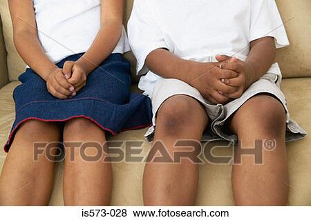 Brother and sister on sofa View Large Photo Image Stock Photo - Brother and sister on sofa. Fotosearch