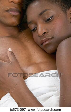 Couple lying in bed View Large Photo Image Stock Photo - Couple lying in bed. Fotosearch