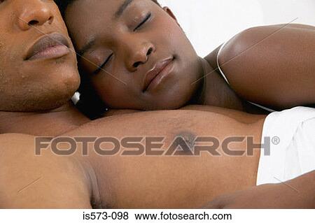 Couple sleeping in bed View Large Photo Image Stock Photo - Couple sleeping in bed. Fotosearch