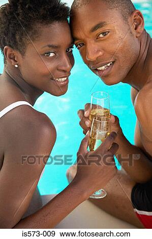 Stock Photo - Couple toasting with champagne. Fotosearch