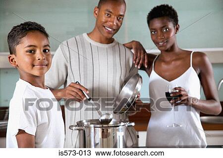 Stock Image - Family in kitchen. Fotosearch