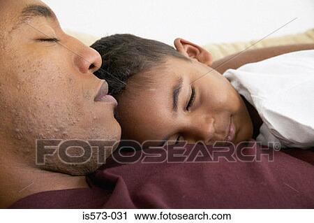 Father and son sleeping View Large Photo Image Stock Image - Father and son sleeping. Fotosearch