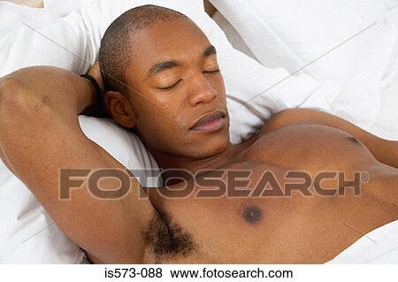 Man sleeping in bed View Large Photo Image Stock Photo - Man sleeping in bed. Fotosearch