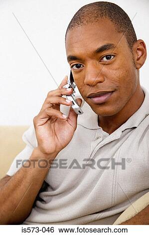 Stock Photograph - Man using cellular telephone. Fotosearch