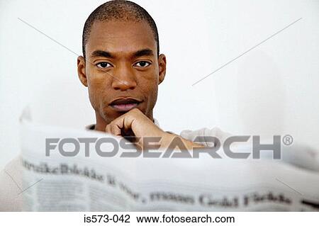 Man with broadsheet newspaper View Large Photo Image Stock Image - Man with broadsheet newspaper. Fotosearch