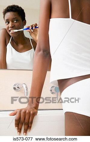 Woman brushing teeth View Large Photo Image Stock Photo - Woman brushing teeth. Fotosearch