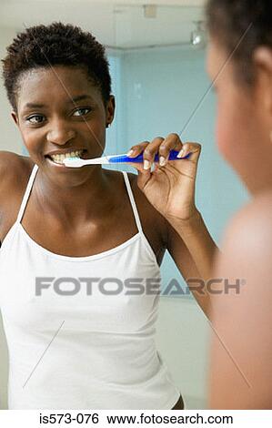 Woman brushing teeth View Large Photo Image Stock Photograph - Woman brushing teeth. Fotosearch