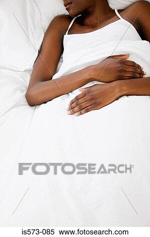 Woman resting in bed View Large Photo Image Stock Photography - Woman resting in bed. Fotosearch