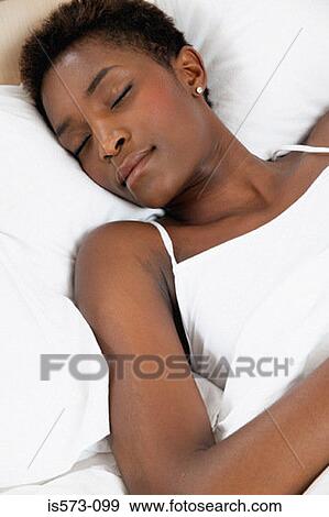 Woman sleeping in bed View Large Photo Image Stock Photo - Woman sleeping in bed. Fotosearch