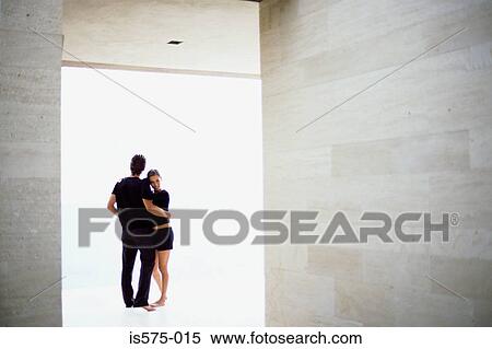 Stock Photography - Couple in spacious room. Fotosearch