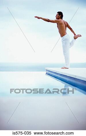 Yoga by the swimming pool View Large Photo Image Stock Photography - Yoga by the swimming pool. Fotosearch