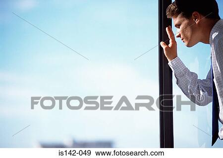 Stock Photo - Businessman at the window. Fotosearch