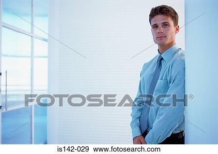 Businessman looks at camera View Large Photo Image Stock Photo - Businessman looks at camera. Fotosearch