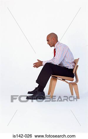 Businessman sits thinking View Large Photo Image Stock Photograph - Businessman sits thinking. Fotosearch