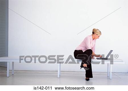 Businesswoman works laptop View Large Photo Image Stock Image - Businesswoman works laptop. Fotosearch