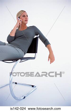 Female with mobile phone View Large Photo Image Picture - Female with mobile phone. Fotosearch