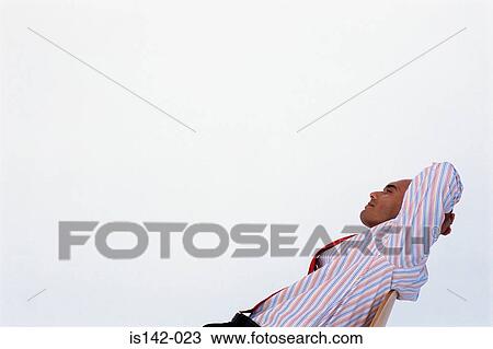 Stock Image - Satisfied businessman relaxing. Fotosearch