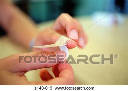 Applying plaster on finger View Large Photo Image Stock Image - Applying plaster on finger. Fotosearch