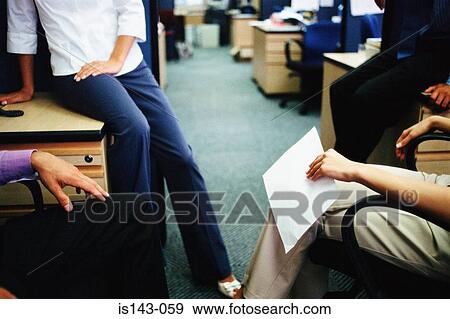 Four colleagues meet in office View Large Photo Image Stock Photo - Four colleagues meet in office. Fotosearch
