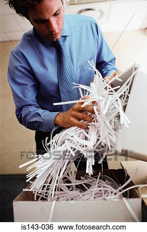 Man emptying shredder bin View Large Photo Image Stock Photograph - Man emptying shredder bin. Fotosearch