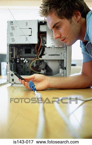 Man with computer leads View Large Photo Image Stock Photo - Man with computer leads. Fotosearch