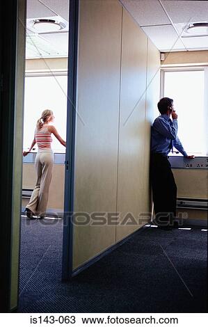 Office staff look out of window View Large Photo Image Stock Image - Office staff look out of window. Fotosearch