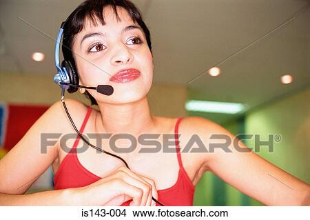 Picture - Receptionist with microphone. Fotosearch