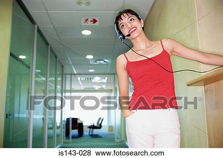 Smiling receptionist at work View Large Photo Image Stock Photo - Smiling receptionist at work. Fotosearch