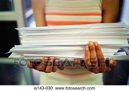 Woman carrying stack of paper View Large Photo Image Stock Image - Woman carrying stack of paper. Fotosearch