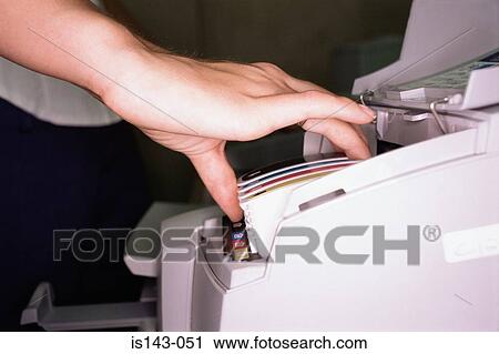 Woman fits colour cartridge View Large Photo Image Stock Image - Woman fits colour cartridge. Fotosearch