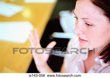 Stock Photo - Woman gesticulating with hand. Fotosearch