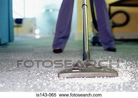 Woman hoovers messy carpet View Large Photo Image Stock Photography - Woman hoovers messy carpet. Fotosearch