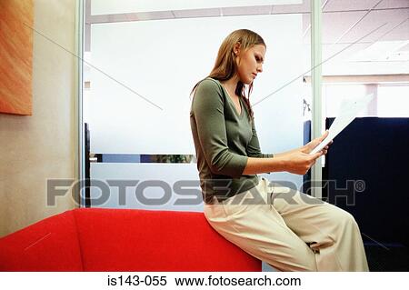 Woman reading paper View Large Photo Image Stock Photography - Woman reading paper. Fotosearch