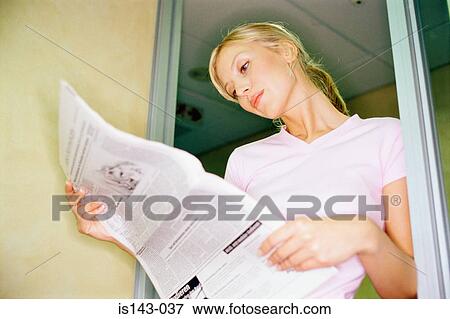 Woman reading the newspaper View Large Photo Image Stock Photo - Woman reading the newspaper. Fotosearch