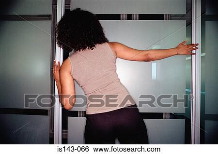 Woman tries to see next door View Large Photo Image Stock Photograph - Woman tries to see next door. Fotosearch