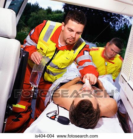 Ambulance staff with patient View Large Photo Image Picture - Ambulance staff with patient. Fotosearch