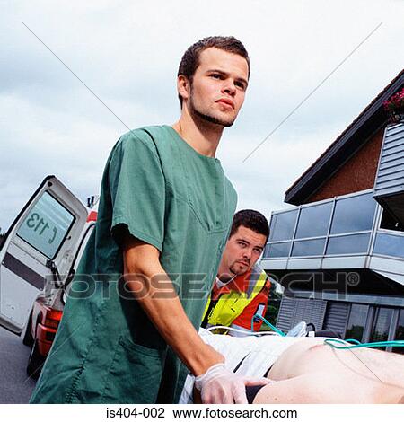 Ambulance staff with patient View Large Photo Image Stock Image - Ambulance staff with patient. Fotosearch