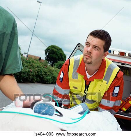 Ambulance staff with patient View Large Photo Image Stock Image - Ambulance staff with patient. Fotosearch