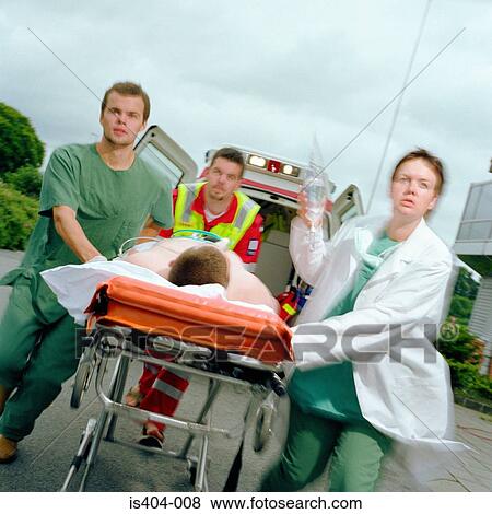 Ambulance staff with patient View Large Photo Image Stock Photo - Ambulance staff with patient. Fotosearch