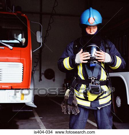 Picture - Fireman getting ready to leave. Fotosearch