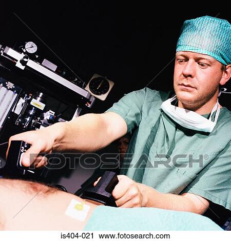 Nurse defibrillating patient Stock Image | is404-021 | Fotosearch