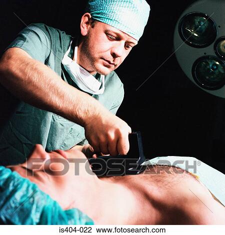 Nurse defibrillating patient View Large Photo Image Stock Image - Nurse defibrillating patient. Fotosearch