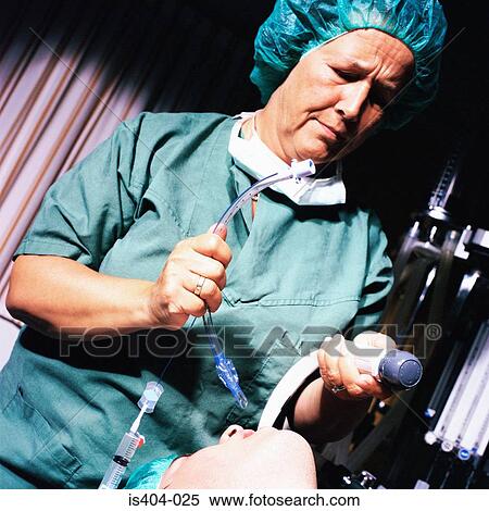 Nurse intubating patient View Large Photo Image Stock Photography - Nurse intubating patient. Fotosearch