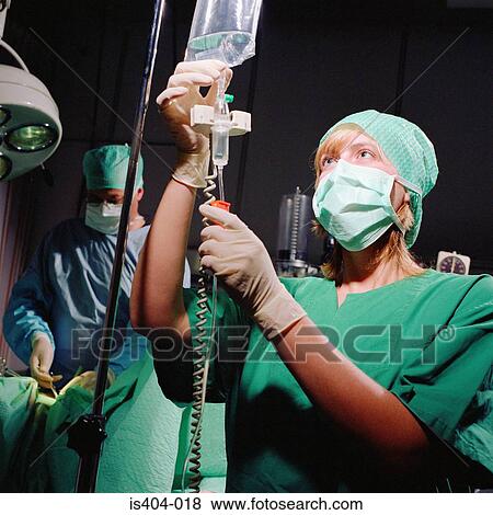 Stock Photo - Nurse monitoring fluids. Fotosearch