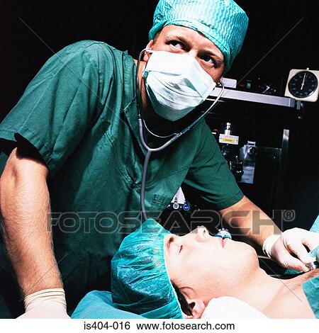 Stock Photograph - Nurse monitoring patient. Fotosearch
