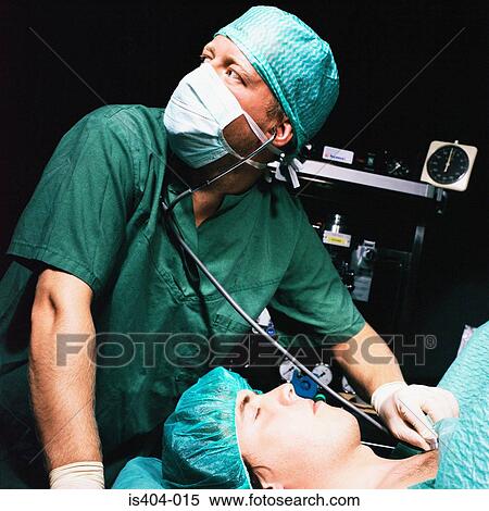 Stock Photography - Nurse monitoring patient. Fotosearch