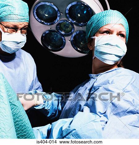 Picture - Surgical team watch monitor. Fotosearch